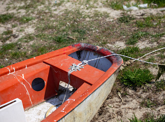Front of old boat on sandy beach, Greece