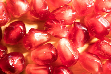 composition of ripe juicy pomegranate, berries pomegranate macro