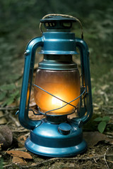 Antique oil lamp inside the forest