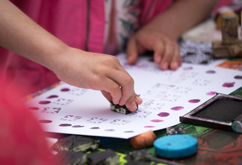 Children playing wuth stamps