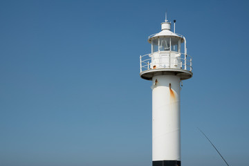 Fototapeta na wymiar Lighthouse of Blankberge, Belgium. Blue sky, space for text.
