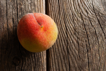 peach fruit on old weathered wooden table background