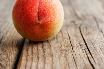 peach fruit on old weathered wooden table background