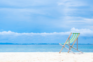 Colorful beach chairs Placed on the sand and peaceful sea Suitable for resting on weekends. Or summer