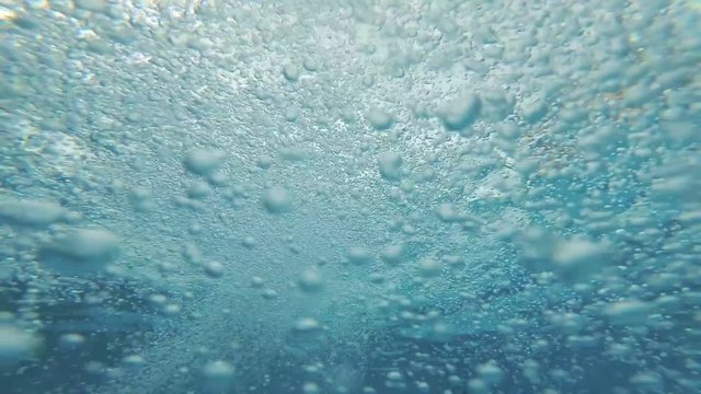 Bubbles under water. Marine background. Air bubbles in water.