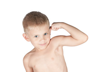 little boy is showing his arm muscles