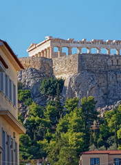 Fototapeta na wymiar Athens Greece, unusual view of Parthenon ancient temple from the street behind acropolis hill