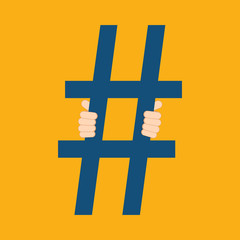 Fototapeta premium Social media prisoner. Human hands holding prison bars stylized as hashtag. Social media addiction concept