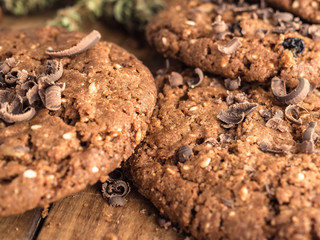 textured chocolate hemp oatmeal cookies on a wooden board