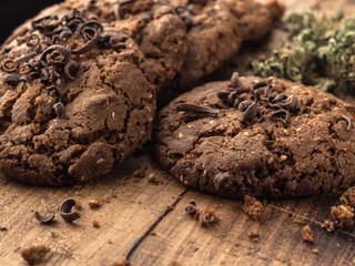 textured chocolate hemp oatmeal cookies on a wooden board
