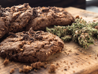 textured chocolate hemp oatmeal cookies on a wooden board