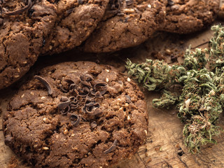 textured chocolate hemp oatmeal cookies on a wooden board