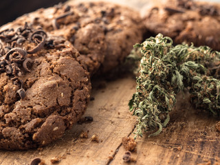 textured chocolate hemp oatmeal cookies on a wooden board