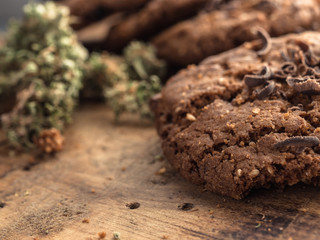 textured chocolate hemp oatmeal cookies on a wooden board