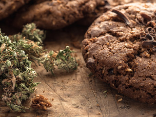 textured chocolate hemp oatmeal cookies on a wooden board
