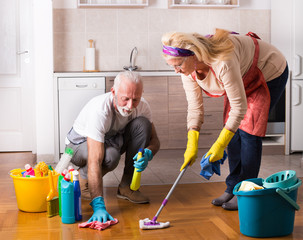 Senior couple doing chores