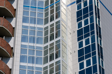 A new residential building on monolithic frame technology in the area with the existing infrastructure. Facade of ceramic tiles and glass.