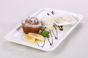 Tasty hot muffin with ice cream