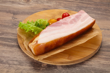 Smoked pork breast with salad leaves