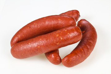Tasty meat sausages over white background