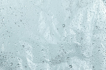Plastic bag and wet surface with water droplets background. Abstract of dew wallpaper.