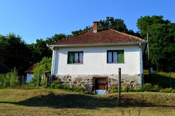 a white old abandoned farmhouse