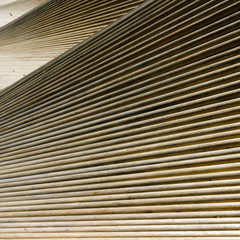 abstract close up view of waves of wooden slats and planks as a background