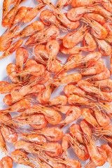 Boiled shrimp on a light background. Seafood