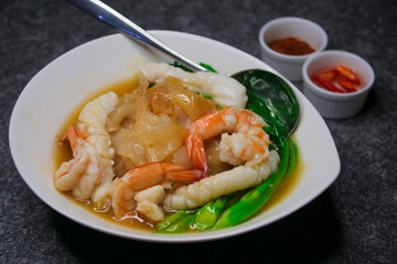 Fried noodle with sea food and kale in gravy