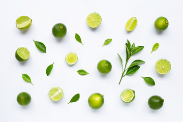 Limes with leaves isolated on white background.