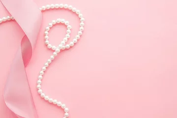 Feminine desktop mockup with pearls and pink ribbon on pink background © iryna1