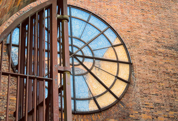 Circle windows on old brick building wall