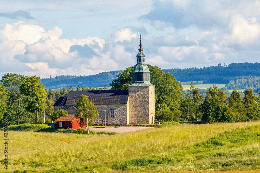 Sticker Swedish countryside church in summer landscape