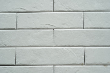 Close up abstract pattern of sandstone brick wall background in vintage tone style and vertical frame,