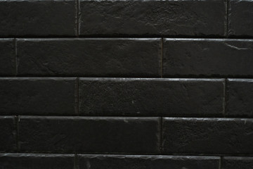 Close up abstract pattern of sandstone brick wall background in vintage tone style and vertical frame,