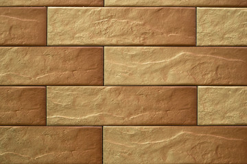 Close up abstract pattern of sandstone brick wall background in vintage tone style and vertical frame,