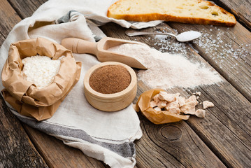 slice of bread and ingredients on old weathered wooden table