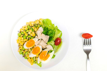 Vegetable salad with chicken breast and boiled egg. Salad with vegetables and grains isolated on white background. Top view