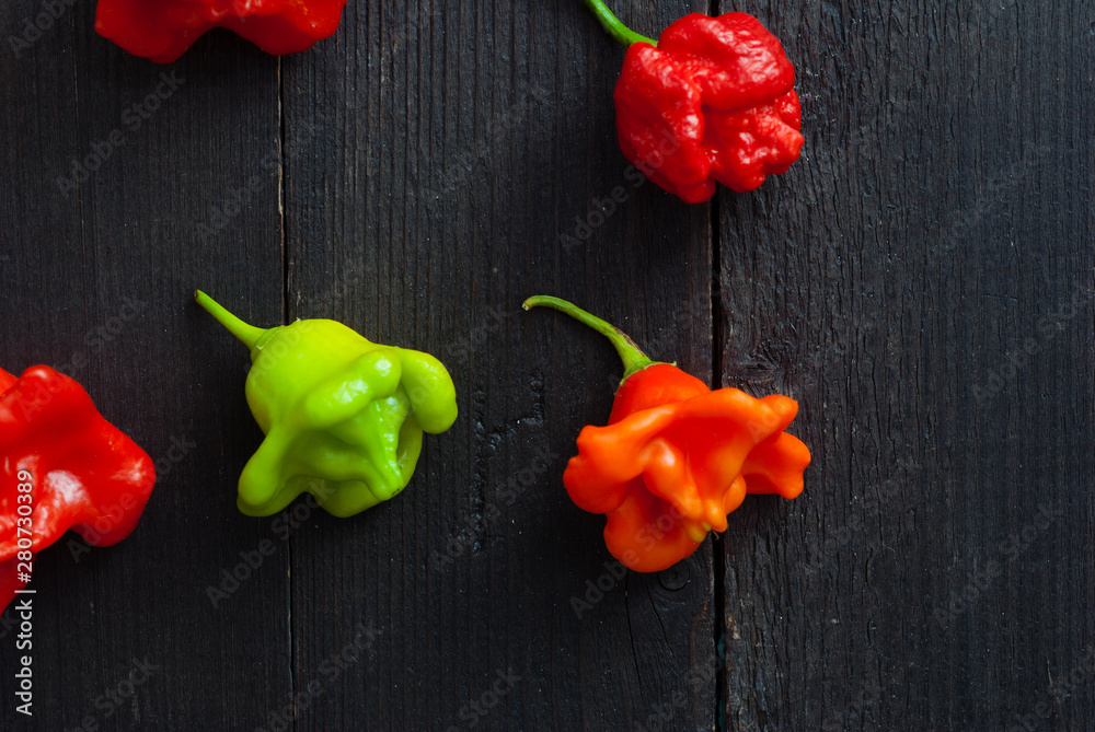 Canvas Prints chili peppers on black wood table