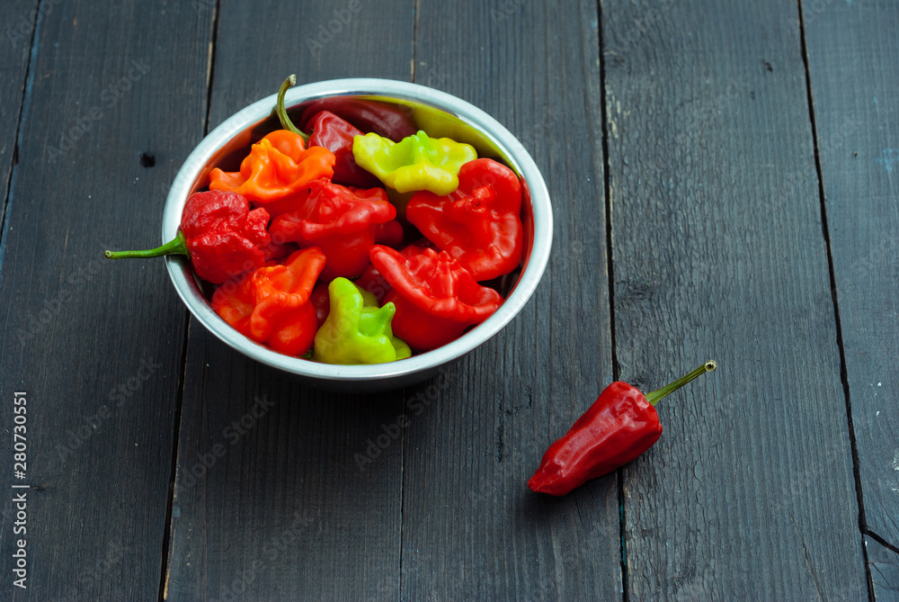 Canvas Prints chili peppers on black wood table