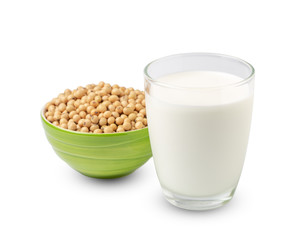 Glass of Soy milk with soybeans in green bowl isolated on white background.