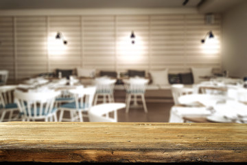 Wooden desk of free space and summer bar background 