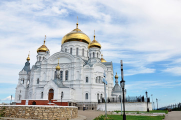 Fototapeta na wymiar Beautiful orthodox church with gold domes.