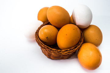eggs in a basket isolated on white