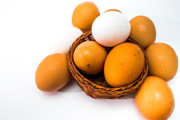 eggs in a basket isolated on white
