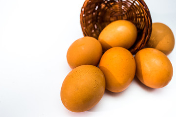 eggs in a basket isolated on white
