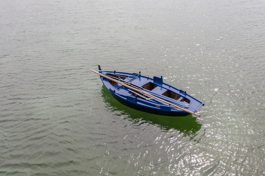 wooden fishing boat moored at the sea