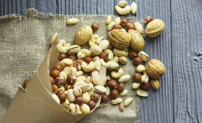 mixed nuts on a wooden table, top view