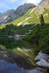 The beautiful lake Popradske pleso in the High Tatras in the evening sun.