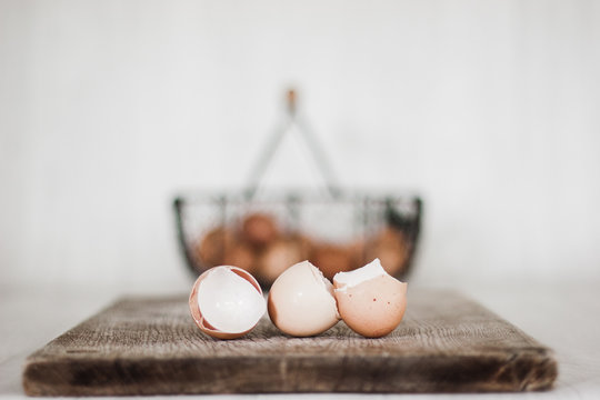 egg shells and eggs in a basket